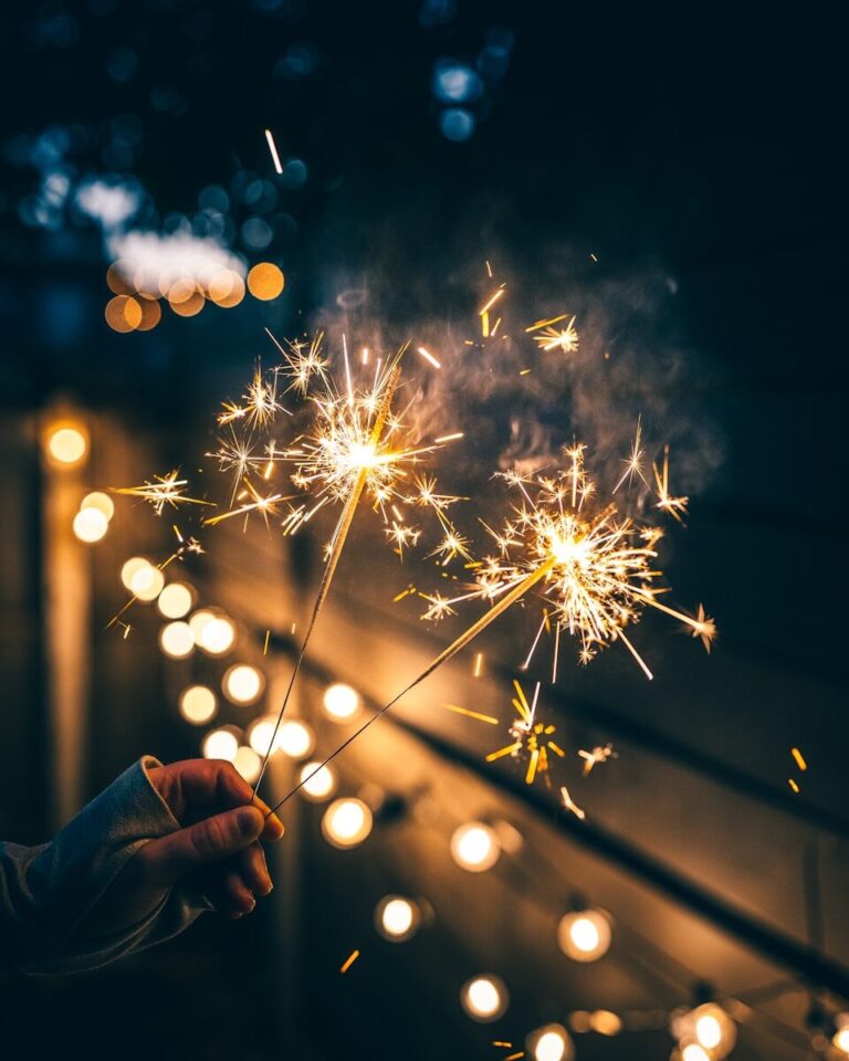 a person holding a sparkler in their hand